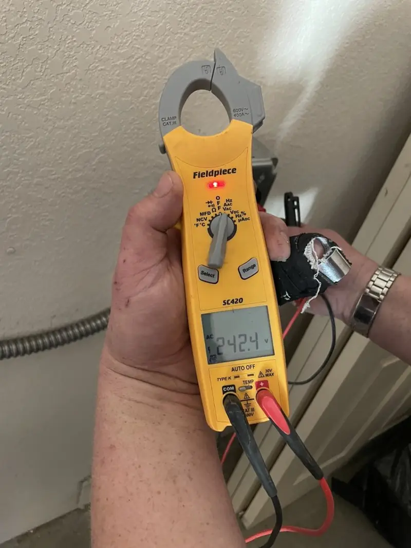 Voltage testing with clamp meter during Electrical Installation Services in Elmwood Park